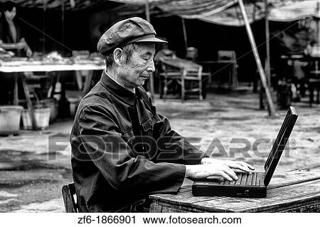 Old Chinese man on laptop computer in Shanghai China View Large Photo Image Stock Image - Old Chinese man on laptop computer in Shanghai China. Fotosearch