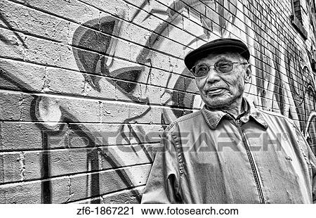 Old Chinese man with wall mural in Chinatown San Francisco California View Large Photo Image Stock Image - Old Chinese man with wall mural in Chinatown San Francisco California. Fotosearch