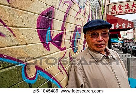 Old Chinese man with wall mural in Chinatown San Francisco California View Large Photo Image Stock Photograph - Old Chinese man with wall mural in Chinatown San Francisco California. Fotosearch