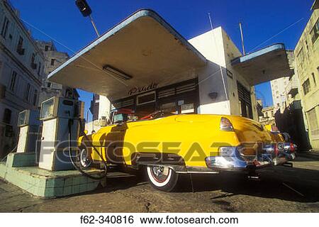 Stock Photograph - Old classic american car parked at gas station in Old Havana. Cuba. Fotosearch