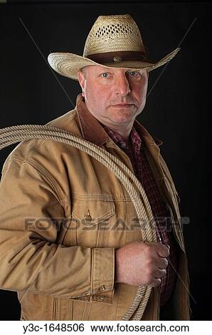 Old cowboy with rope portrait View Large Photo Image Stock Photograph - Old cowboy with rope portrait. Fotosearch