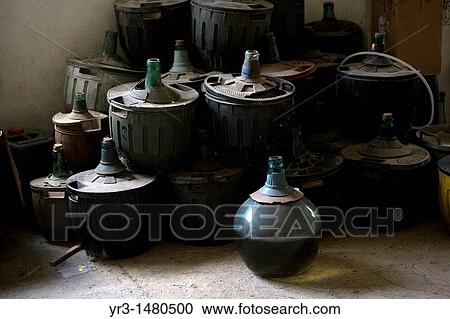 Old demijohns sit in a storage room in a house of El Gastor village in the Sierra de Grazalema Natural Park, Cadiz province, Andalusia, Spain, april 26, 2011 View Large Photo Image Stock Image - Old demijohns sit in a storage room in a house of El Gastor village in the Sierra de Grazalema Natural Park, Cadiz province, Andalusia, Spain, april 26, 2011. Fotosearch