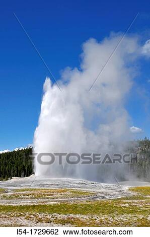 Stock Image - Old Faithful Geyser Yellowstone National Park Wyoming WY United States. Fotosearch