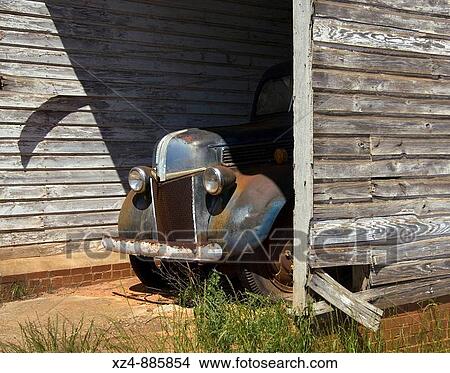 Picture - old farm truck in shed. Fotosearch