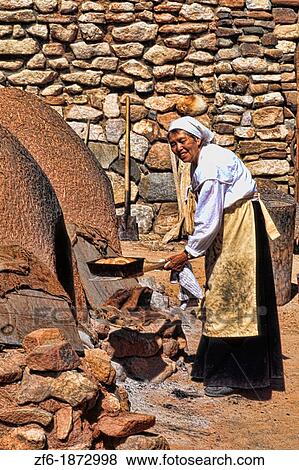 Old fashioned woman baking bread in old style in San Miguel de Allende Mexico View Large Photo Image Stock Photo - Old fashioned woman baking bread in old style in San Miguel de Allende Mexico. Fotosearch