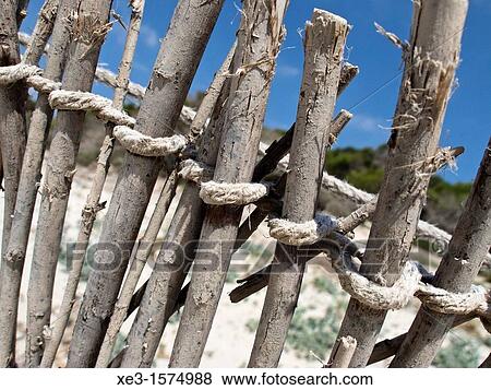 Stock Photo - Old fence on a Majorcan beach. Fotosearch