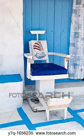 Old fishing chair outside of a Syrmata house in Klima, Milos, Greece View Large Photo Image Stock Photography - Old fishing chair outside of a Syrmata house in Klima, Milos, Greece. Fotosearch