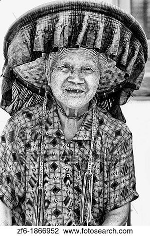 Old Hakka woman with pipe in the old walled city of Kam Tin in the New Territories area of Hong Kong This is a dying breed of woman for tourists with black hats and black clothes with smoking View Large Photo Image Stock Image - Old Hakka woman with pipe in the old walled city of Kam Tin in the New Territories area of Hong Kong This is a dying breed of woman for tourists with black hats and black clothes with smoking. Fotosearch