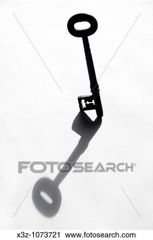 Old key casting a shadow View Large Photo Image Stock Image - Old key casting a shadow. Fotosearch