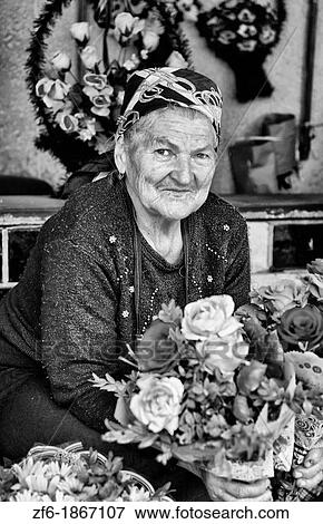 Old lady babushkas selling flowers at market in old town center city of Lviv Ukraine View Large Photo Image Stock Photo - Old lady babushkas selling flowers at market in old town center city of Lviv Ukraine. Fotosearch