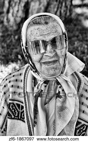 Old lady with scarf babushka portrait in park of Kiev Ukraine View Large Photo Image Stock Photo - Old lady with scarf babushka portrait in park of Kiev Ukraine. Fotosearch