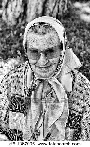 Old lady with scarf babushka portrait in park of Kiev Ukraine View Large Photo Image Stock Photograph - Old lady with scarf babushka portrait in park of Kiev Ukraine. Fotosearch