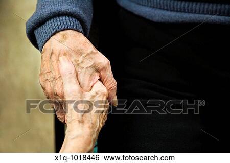 Old man and woman holding hands View Large Photo Image Stock Photograph - Old man and woman holding hands. Fotosearch