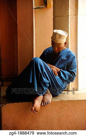 Stock Photo - Old man asleep, Muttrah Souk, Muscat, Oman. Fotosearch