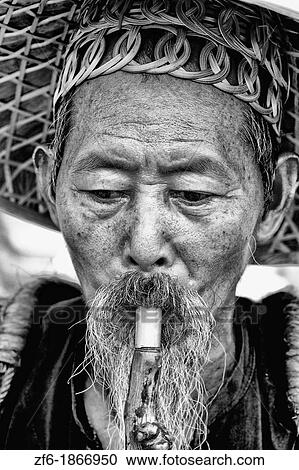 Old man fisherman portrait in traditional costume in Yangshuo China View Large Photo Image Stock Image - Old man fisherman portrait in traditional costume in Yangshuo China. Fotosearch
