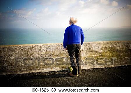 Old man looking the sea, Ortegal cape, A Corua, Galicia, Spain View Large Photo Image Stock Photo - Old man looking the sea, Ortegal cape, A Corua, Galicia, Spain. Fotosearch