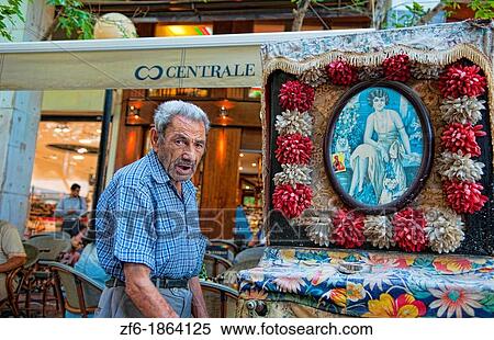 Stock Photography - Old man playing instrument called Laterna in Plaka in downtown Athens Greece. Fotosearch