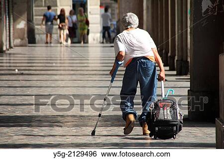 old man walking in the esquilino district of rome italy View Large Photo Image Stock Photograph - old man walking in the esquilino district of rome italy. Fotosearch
