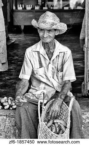 Old man with his basket of fruit on streets of old village of Trinidad Cuba View Large Photo Image Stock Image - Old man with his basket of fruit on streets of old village of Trinidad Cuba. Fotosearch