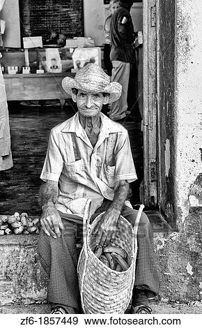 Old man with his basket of fruit on streets of old village of Trinidad Cuba View Large Photo Image Stock Photo - Old man with his basket of fruit on streets of old village of Trinidad Cuba. Fotosearch