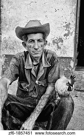 Old man with his chicken on streets of old village of Trinidad Cuba View Large Photo Image Stock Image - Old man with his chicken on streets of old village of Trinidad Cuba. Fotosearch