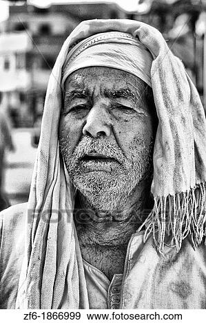 Old Muslim man portrait in traditional clothes in Cairo Egypt View Large Photo Image Stock Photo - Old Muslim man portrait in traditional clothes in Cairo Egypt. Fotosearch