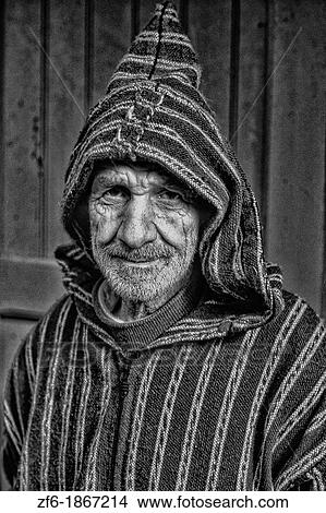 Picture - Old Muslim Man with hood and smiling in Tangier Morocco Africa Portrait. Fotosearch
