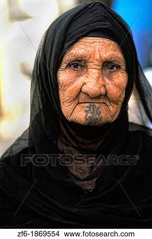 Old Muslim woman portrait in traditional clothes and tattoos in Cairo Egypt View Large Photo Image Picture - Old Muslim woman portrait in traditional clothes and tattoos in Cairo Egypt. Fotosearch
