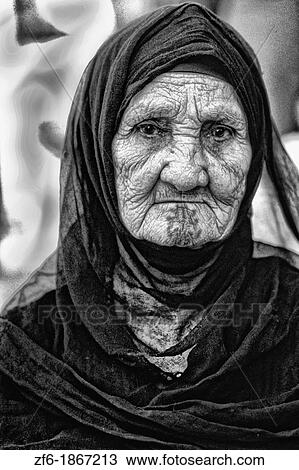 Old Muslim woman portrait in traditional clothes and tattoos in Cairo Egypt View Large Photo Image Stock Image - Old Muslim woman portrait in traditional clothes and tattoos in Cairo Egypt. Fotosearch