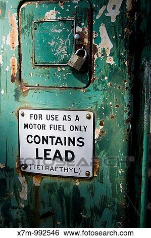 Stock Photograph - Old non-operational gas petrol pump used to pump leaded gasoline, which is illegal in US on-road vehicles because of environmental concerns but still legal in other vehicles. Fotosearch