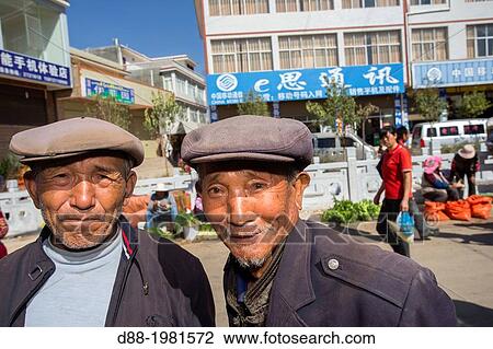Old peasants at market, Han people, Niujie village, Yunnan province, China View Large Photo Image Stock Image - Old peasants at market, Han people, Niujie village, Yunnan province, China. Fotosearch