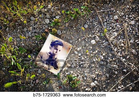 old photograph of a child, lost in the ground View Large Photo Image Stock Image - old photograph of a child, lost in the ground. Fotosearch