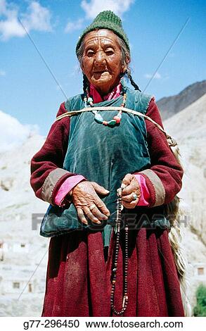 Old pilgrim woman to Lamayuru Monastery. Ladakh. Jammu and Kashmir, India View Large Photo Image Stock Image - Old pilgrim woman to Lamayuru Monastery. Ladakh. Jammu and Kashmir, India. Fotosearch