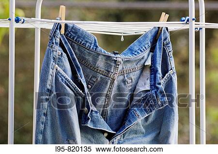 Old, ripped, well worn jeans trousers put to dry View Large Photo Image Stock Photography - Old, ripped, well worn jeans trousers put to dry. Fotosearch