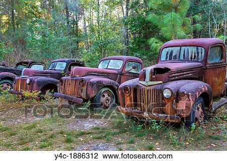 Old rusty broken down junk trucks View Large Photo Image Stock Image - Old rusty broken down junk trucks. Fotosearch