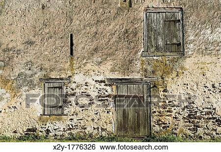 Stock Photograph - Old stone barn facade. Fotosearch