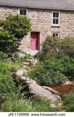 Old stone built cottage with a clapper bridge crossing the stream in front of it Cornwall, England View Large Photo Image Stock Photograph - Old stone built cottage with a clapper bridge crossing the stream in front of it Cornwall, England. Fotosearch