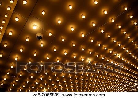 Old style theater marquee lights walkway to the theater. Aligned theater lights of Chicago Theatre. View Large Photo Image Stock Photo - Old style theater marquee lights walkway to the theater. Aligned theater lights of Chicago Theatre.. Fotosearch