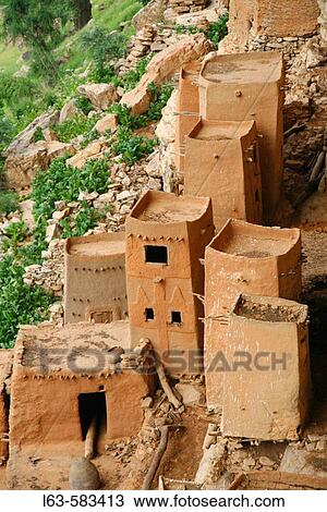 Old Tellem dwellings built into the face of the Bandiagara Escarpment. Dogon Country, Mali View Large Photo Image Stock Image - Old Tellem dwellings built into the face of the Bandiagara Escarpment. Dogon Country, Mali. Fotosearch