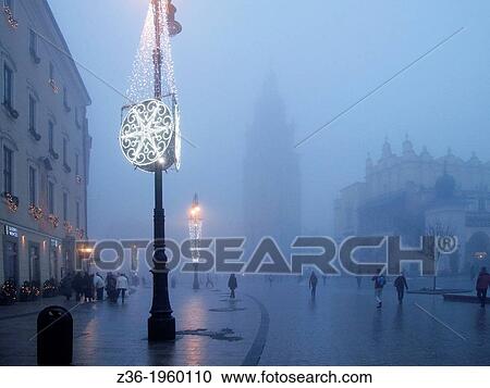 Stock Image - Old Town at Christmas time night, Krakow, Poland.. Fotosearch