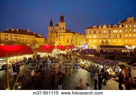 Old Town Square during Christmas time with St Nicholas church in background, Prague, Czech Republic View Large Photo Image Stock Photo - Old Town Square during Christmas time with St Nicholas church in background, Prague, Czech Republic. Fotosearch