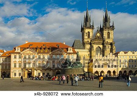 Stock Image - Old Town Square with Kinsky Palace, Jan Hus Monument, and Tyn Cathedral in Prague Czech Republic. Fotosearch