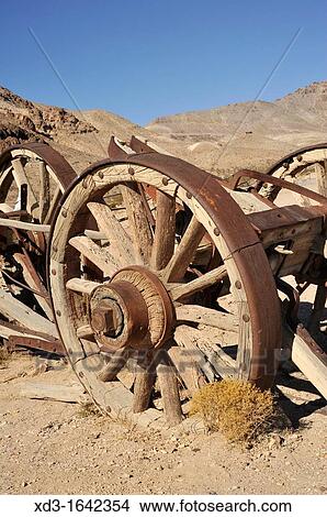 old wagon wheel, Rhyolite Ghost Town, Nevada, USA View Large Photo Image Picture - old wagon wheel, Rhyolite Ghost Town, Nevada, USA. Fotosearch
