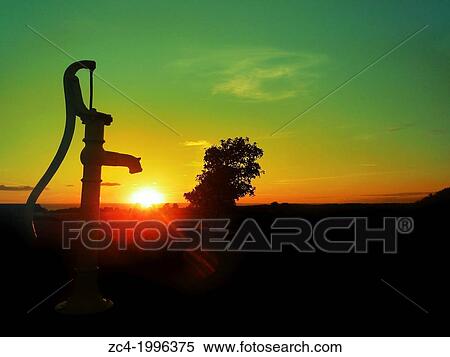 Old water pump. Sunset over the horizon of the sea. View Large Photo Image Stock Photography - Old water pump. Sunset over the horizon of the sea.. Fotosearch
