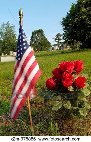 Old weathered headstones in an scenic New England graveyard Artifical flowers and the American flag View Large Photo Image Stock Photograph - Old weathered headstones in an scenic New England graveyard Artifical flowers and the American flag. Fotosearch