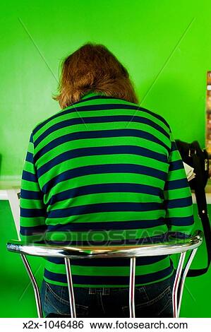 Stock Photograph - Old woman in a coffee shop, Warrnambool, Victoria, Australia. Fotosearch
