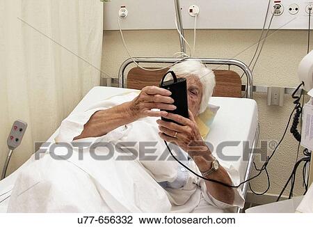 Old woman in a hospital bed View Large Photo Image Stock Image - Old woman in a hospital bed. Fotosearch