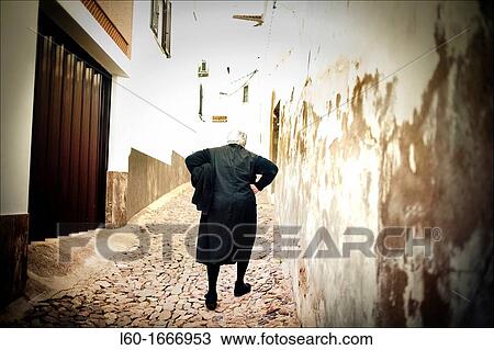 Stock Image - Old woman in Alentejo, Portugal. Fotosearch