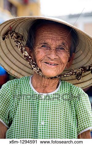 Stock Image - old woman portrait Hoi An, Vietnam, Asia. Fotosearch