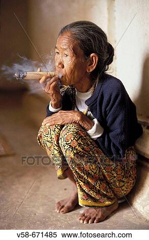 Old woman smoking a cheeroot, Pagan, Myanmar View Large Photo Image Stock Photography - Old woman smoking a cheeroot, Pagan, Myanmar. Fotosearch